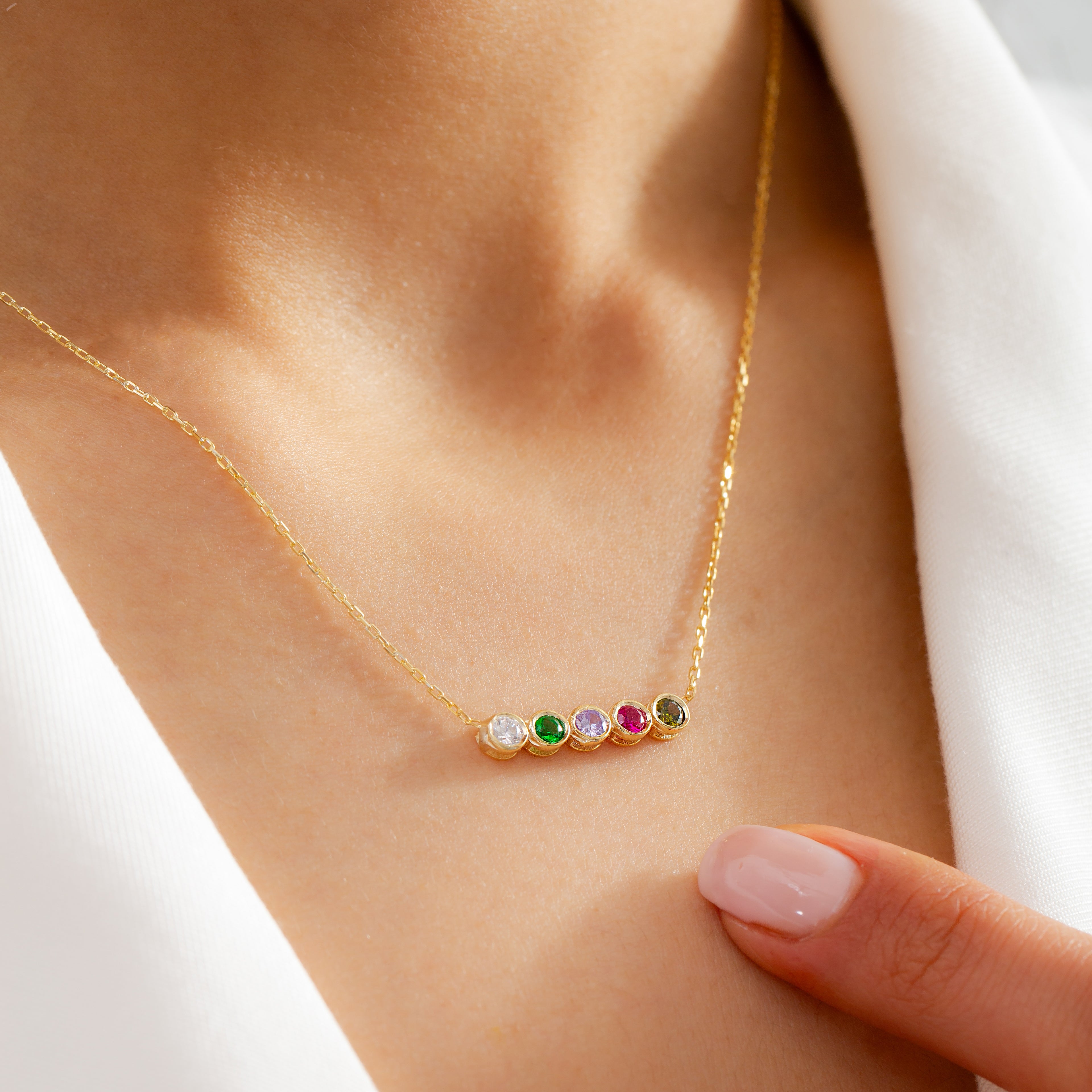 Birthday Necklace on womens neck