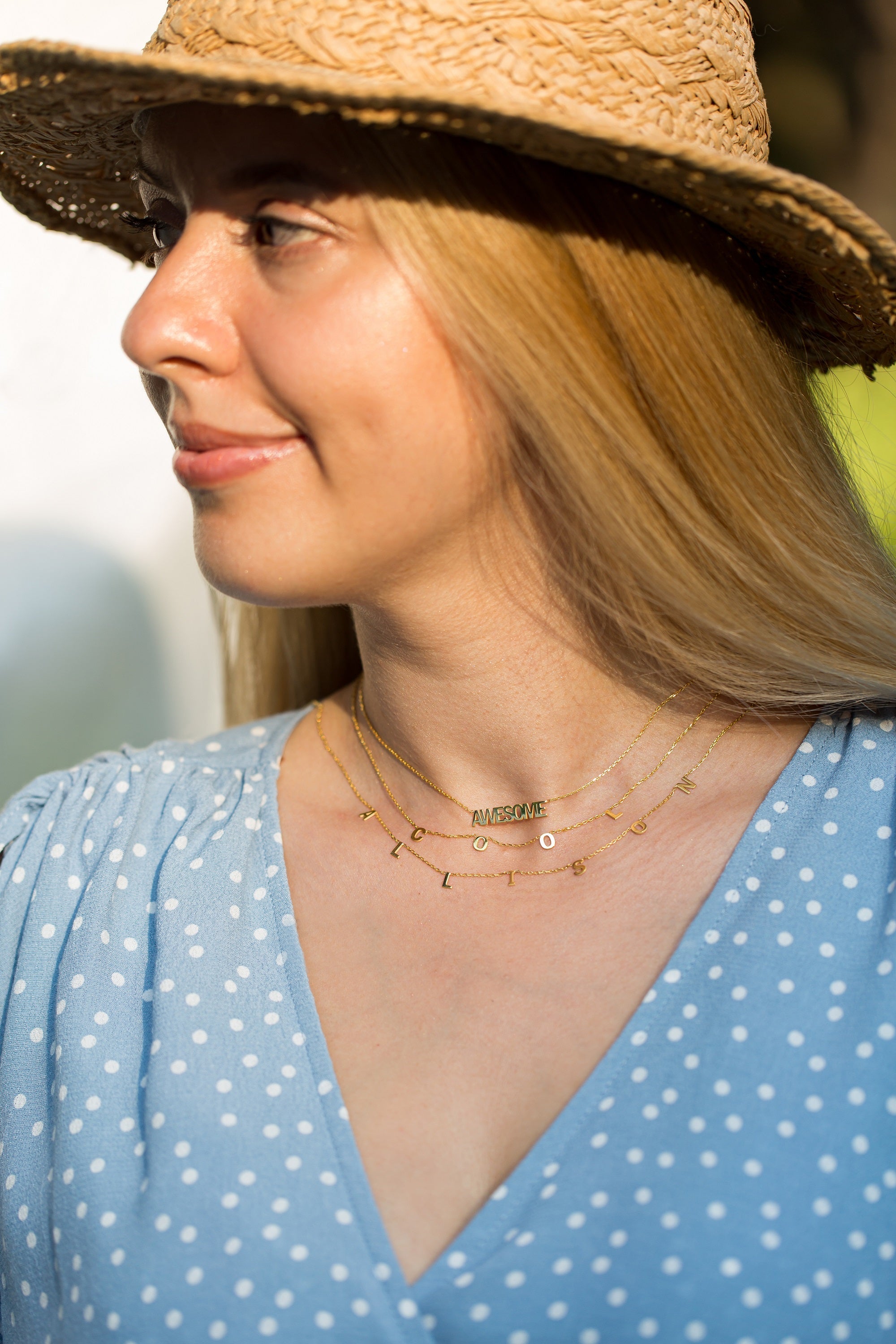 a women with summer jewelry trends and hat