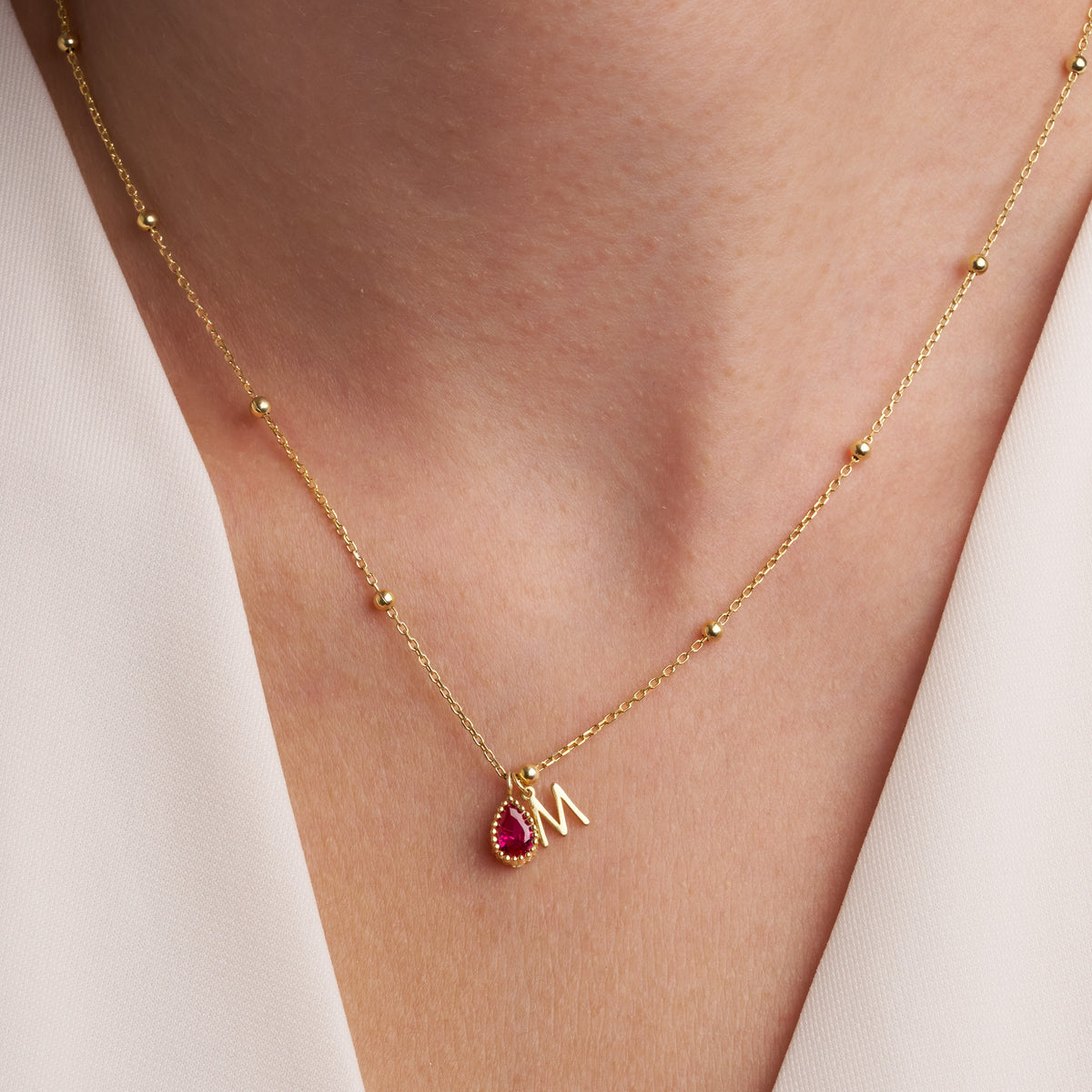 Initial and birthstone charms on the Initial and Birthstone Charm Necklace