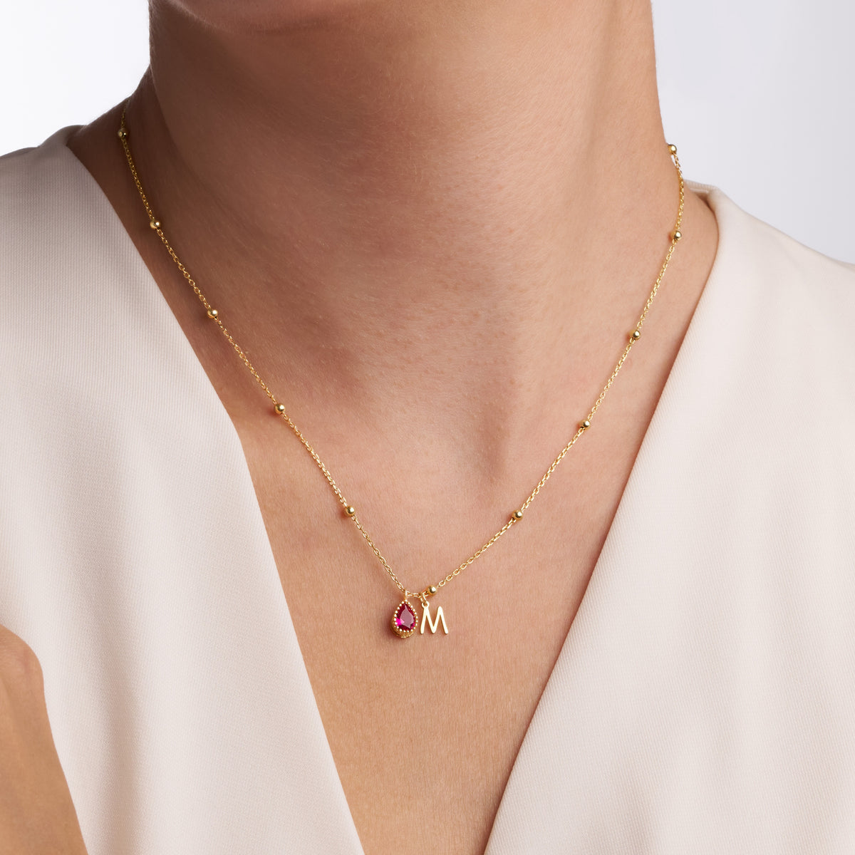 Initial charm detail on the Initial and Birthstone Charm Necklace