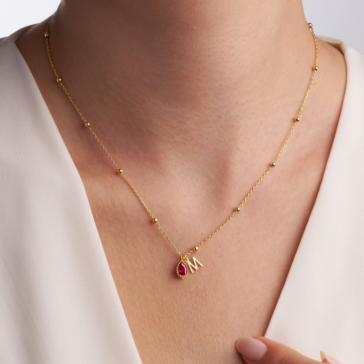 Letter and birthstone charms of the Initial and Birthstone Charm Necklace
