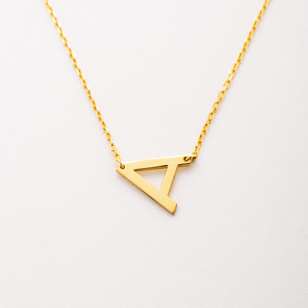 Sideways letter pendant 